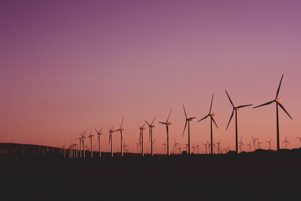 Silhouetted wind turbines at sunset in Zahara de los Atunes, Spain.